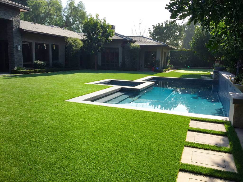 artificial turf on a backyard of a big residential house